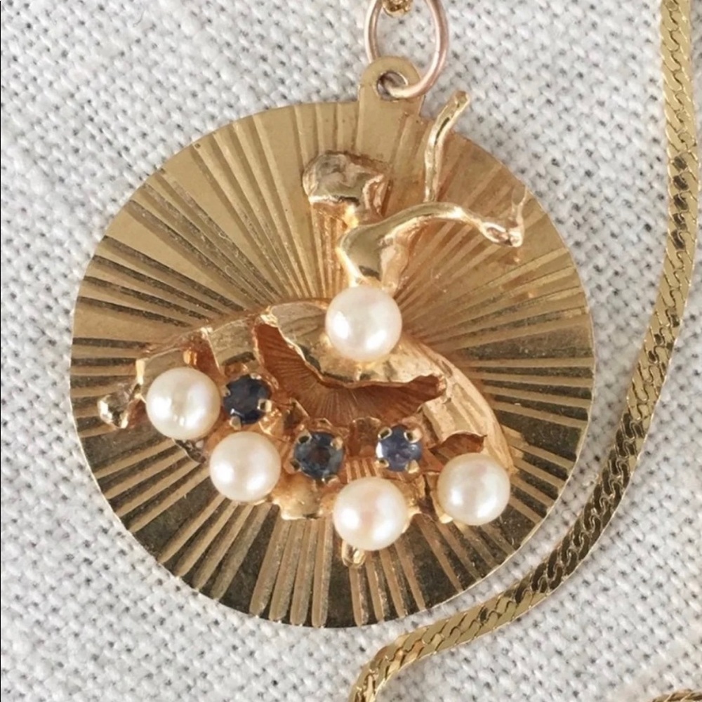 14k gold blue topaz pearl pendant.